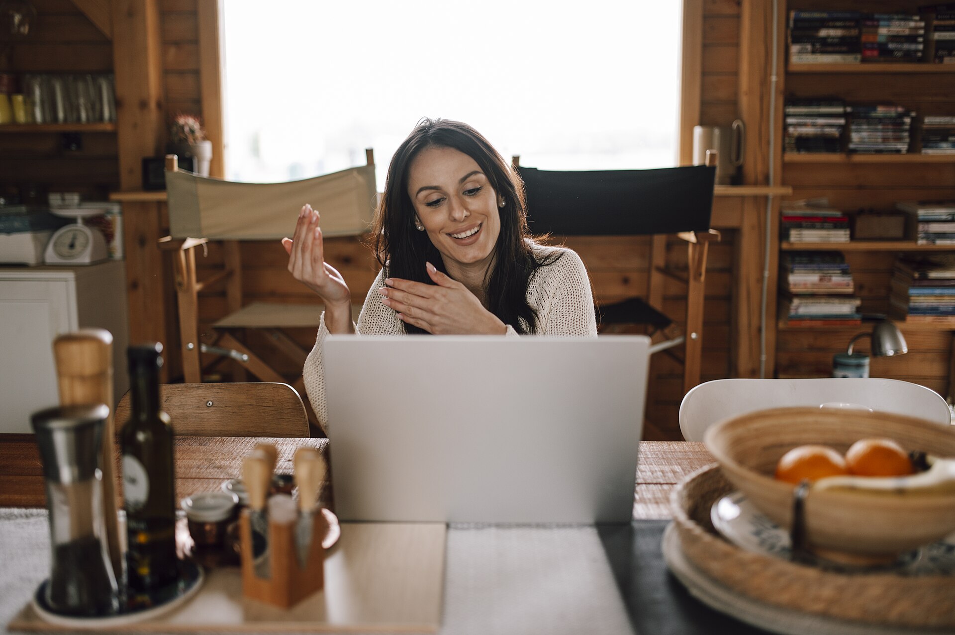 Woman smiling on a video call at her laptop